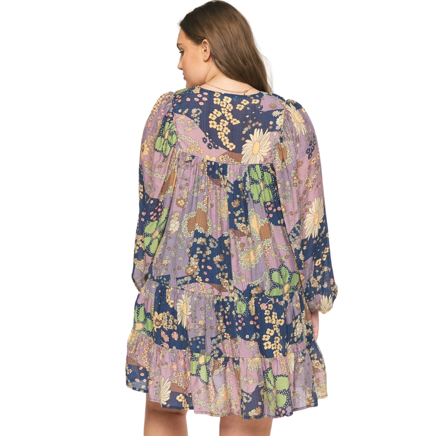 Enjoy effortless style with this beautiful long sleeve tiered mini dress. Crafted from a lightweight fabric featuring a floral print and self-tie detail at the neckline, this mini dress is perfect for any type of occasion. The pockets at the side and tiered hem provide extra convenience and style.