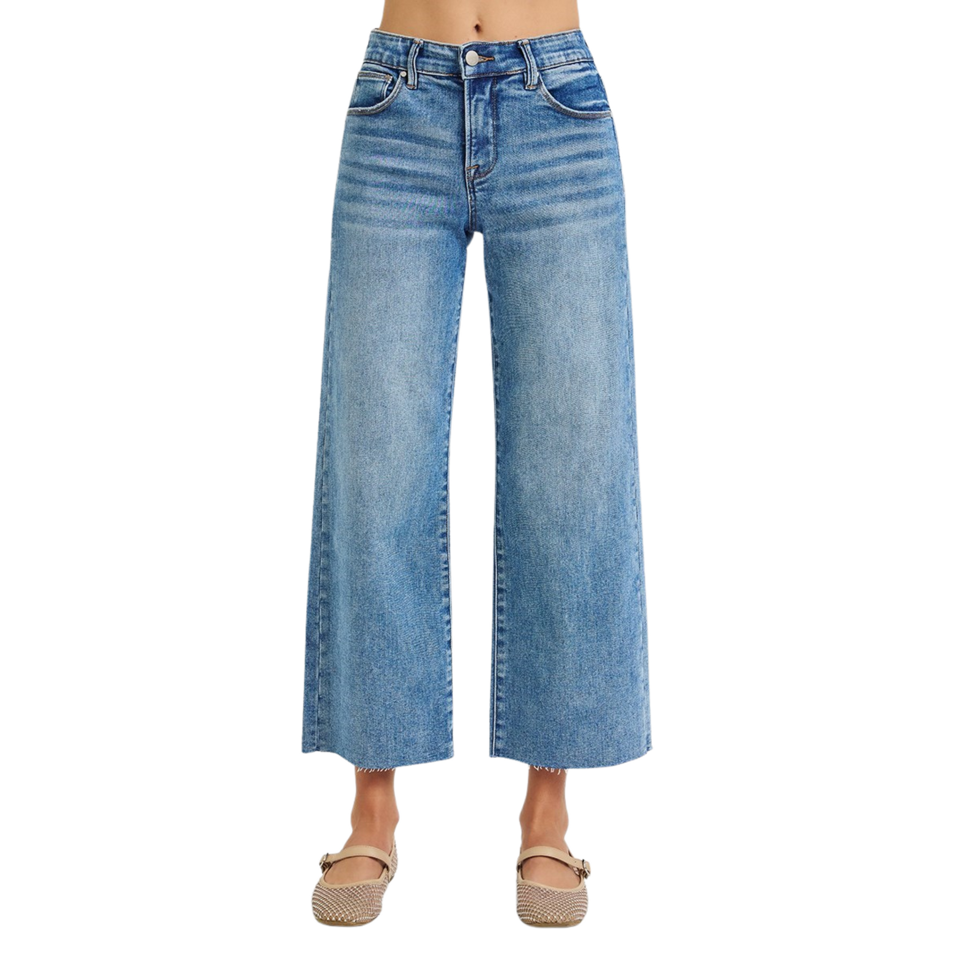 These mid-rise cropped jeans from Risen feature a flattering tummy control design and a wide-leg silhouette for comfort and style. The medium wash adds versatile appeal, while the raw hem provides a modern, edgy finish. Perfect for a polished yet relaxed look.