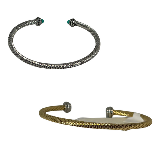 Add modern style to your ensemble with this Twisted Bangle with Stone. Crafted from silver and gold color, this cuff bangle adds an elegant, yet edgy look to any outfit. Perfect for dressing up or down, the bangle is a must-have for any jewelry collection.
