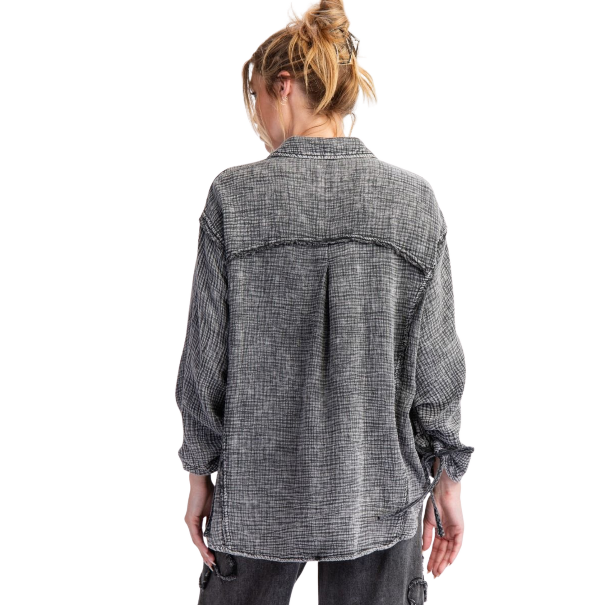 This Washed Cotton Gauze Top from Easel combines lightweight comfort with refined style. Crafted from a breathable gauze cotton blend, it features long sleeves and a classic button-down design for versatile layering. The washed black color adds a subtle, lived-in look, ideal for both casual and polished outfits. Perfect for those seeking breathable fabric with a soft, textured feel.