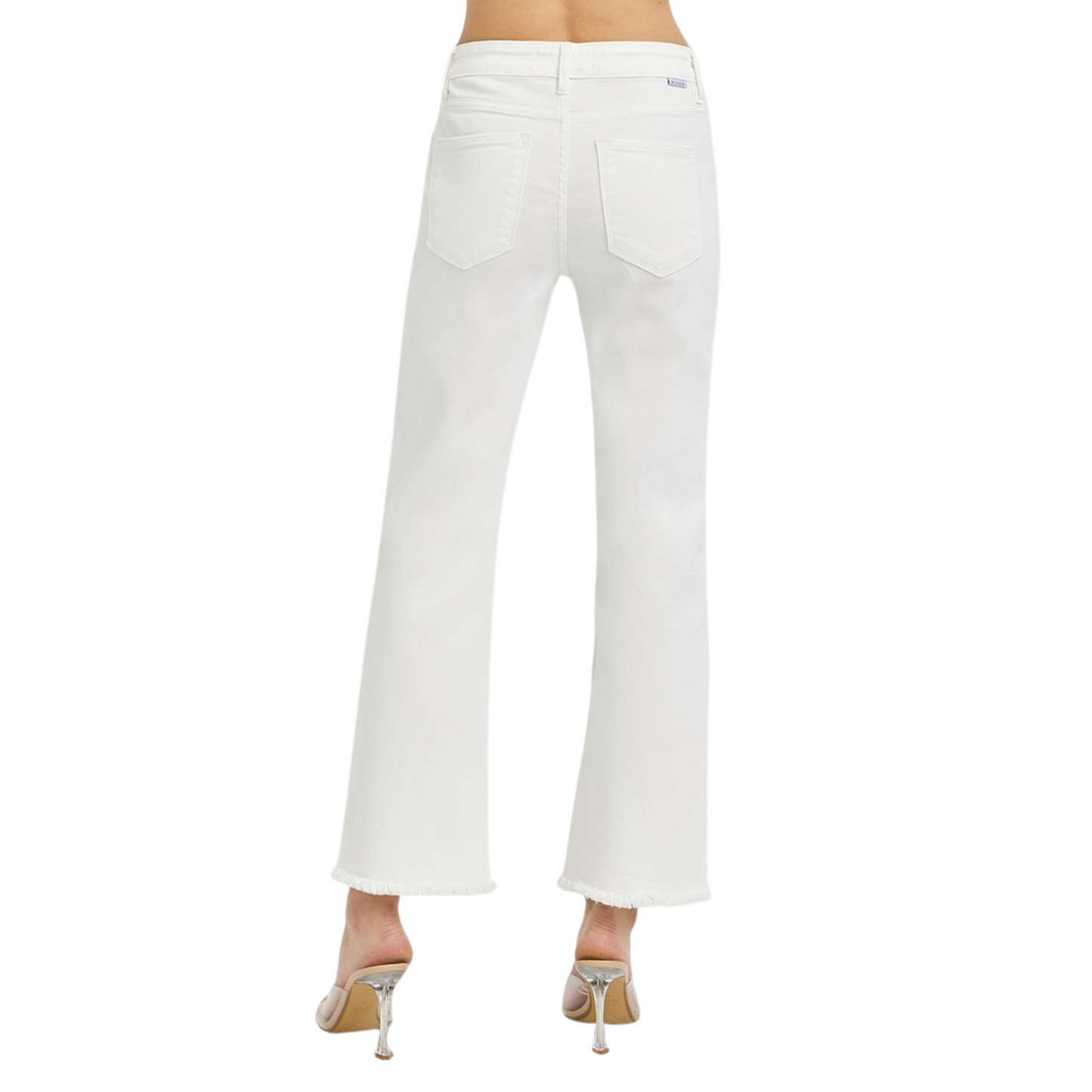 Expertly crafted with tummy control technology, these Mid Rise Cropped Frayed Hem Jeans from Risen provide a flattering fit while the raw hem adds a trendy touch. Made from white denim, these cropped jeans are the perfect addition to your wardrobe for a stylish and slimming look.