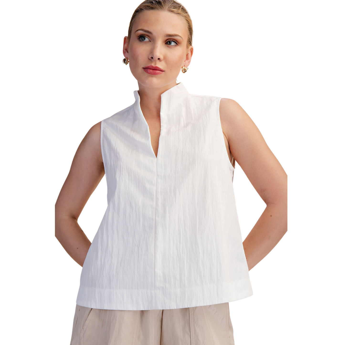 Elevate your wardrobe with this stunning Stand Collar V-Neck Top from Glam. The crisp white fabric offers timeless versatility, while the sleeveless design keeps you cool and comfortable. The split v-neck creates an elegant, flattering silhouette that works beautifully for both casual outings and dressed-up occasions. A modern essential that transitions seamlessly from day to night.