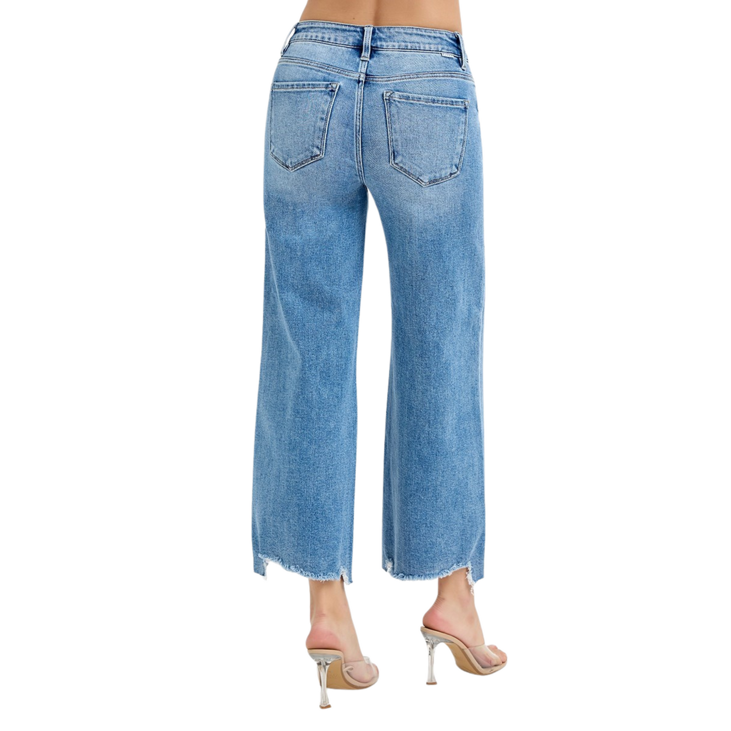 These Risen brand cropped wide-leg jeans feature a high-rise fit and a versatile medium wash, offering a modern silhouette that balances comfort and style. The wide leg design allows for ease of movement and pairs effortlessly with various tops, while the cropped length adds a contemporary touch ideal for showcasing footwear. Perfect for creating polished, everyday looks with expert-level fashion appeal.