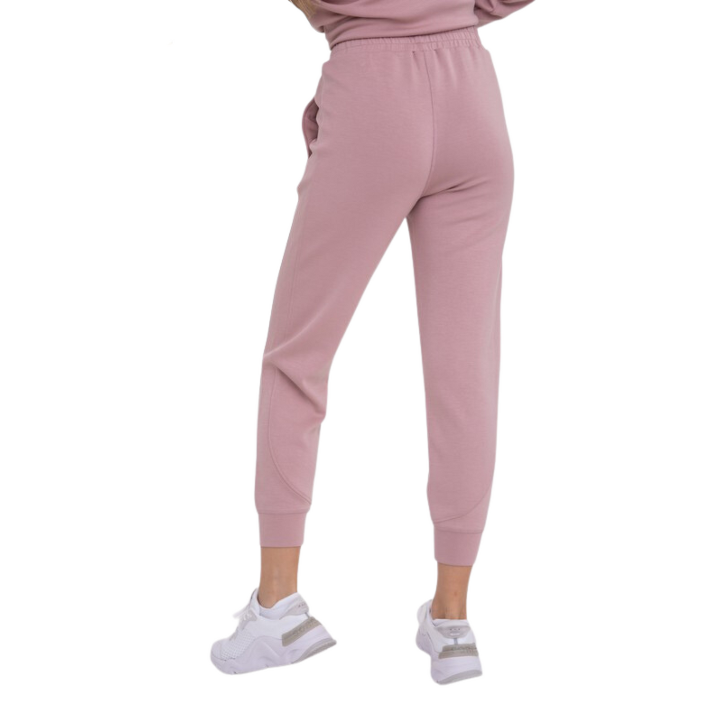 Our Curvy Joggers are designed with comfort and style in mind. Made from butter soft fabric in a neutral mauve color, they feature an elastic waistband, regular size, cuffed hem, and are crafted to flatter all body types. Feel confident and comfortable wearing these stylish joggers.