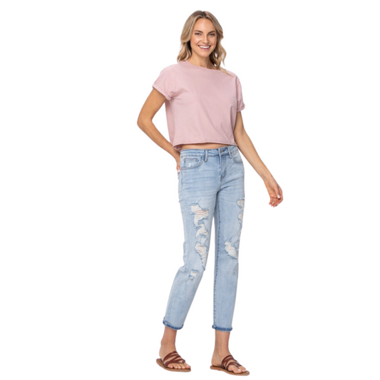 These mid-rise Destroyed Boyfriend Jeans by Judy Blue make a great addition to any wardrobe. The light wash denim pairs well with a variety of looks, providing a unique twist to your favorite styles. Flexible yet durable, these jeans are perfect for dressy occasions or casual weekend wear.