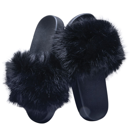 Introducing the Black Diva Slides, perfect for any fashion-forward individual. These sleek slides feature a classic black color and luxurious fur accents, elevating any outfit. With their convenient slide-on design, these slippers provide both comfort and style.