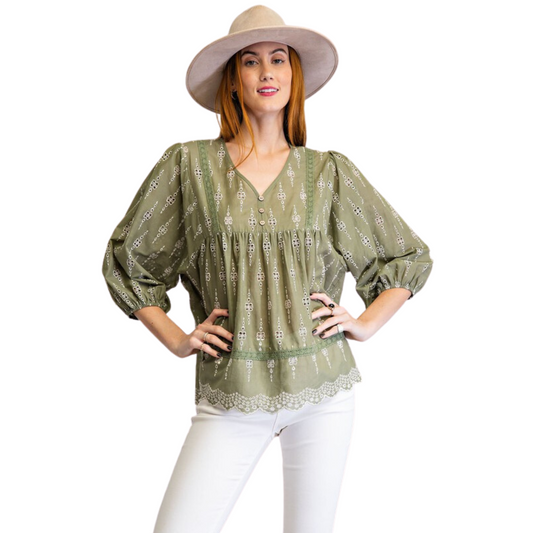 This Eyelet Lace Babydoll Top is perfect for every occasion. Its light olive color is perfect for any casual day out or special night in. Its deep V-neck adds detail and emphasizes the neckline. It's sure to be your favorite go-to.