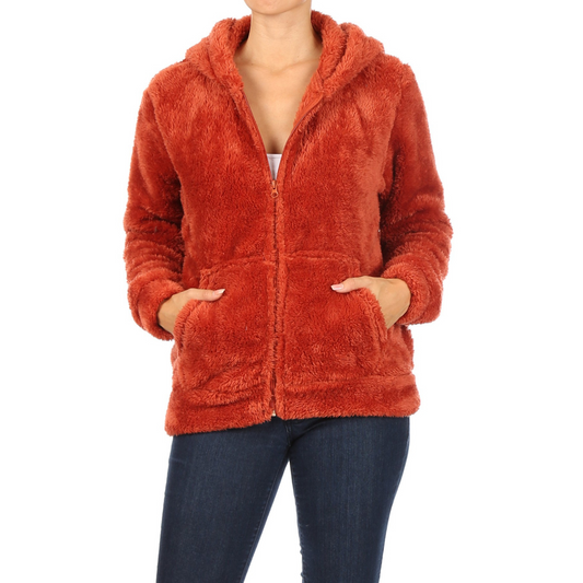 This orange faux fur jacket will keep you warm and cozy with its fluffy, luxurious fabric. Perfect for casual outings or lounge wear, its sherpa-like texture and vibrant color will have you feeling stylish and comfortable.