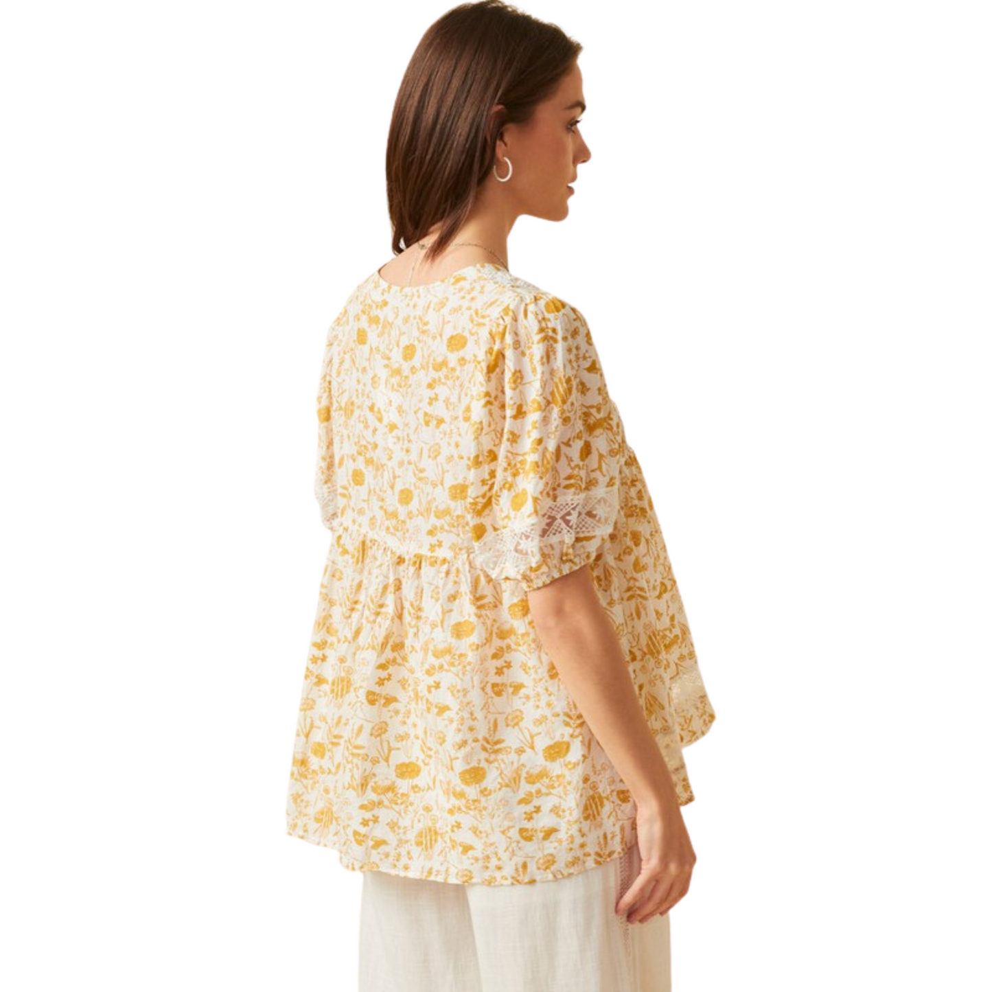 This Floral Lace Puff Sleeve Tunic Top is a stylish combination of modern and classic - featuring a yellow and white floral design, this babydoll top with puff sleeves is perfect for a daytime or evening look. The timeless lace detail is sure to make it a wardrobe staple.