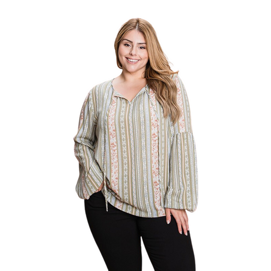 This Front Detail Long Sleeve Top is a must-have for plus size fashionistas. Featuring tie front detail, the top is complete with a vertical stripe pattern for a flattering, modern look. Style yours with jeans for a casual look, or switch it up with tailored pants for a dressier aesthetic.