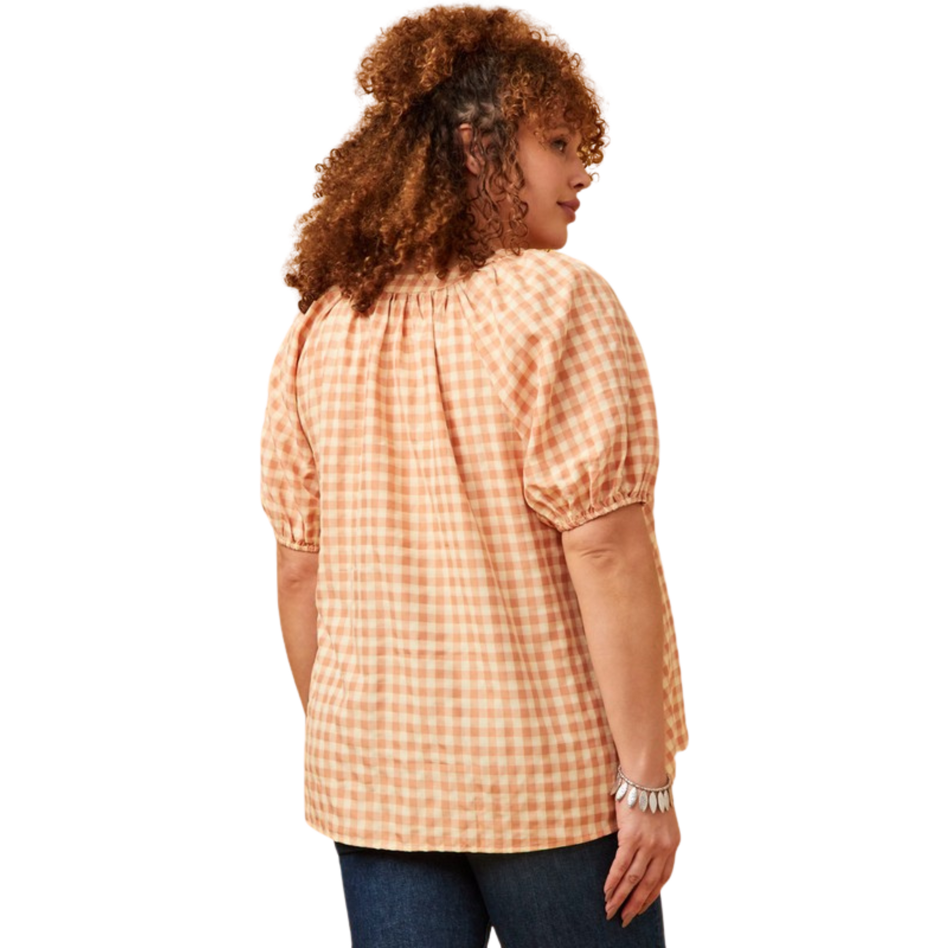 Look stylish with the Gingham Scoop Neck Top. Featuring a peach gingham print and puff sleeves, this top is perfect for a casual or dressy look. Plus sizes are available to flatter any figure. Create a timeless look with this classic piece.