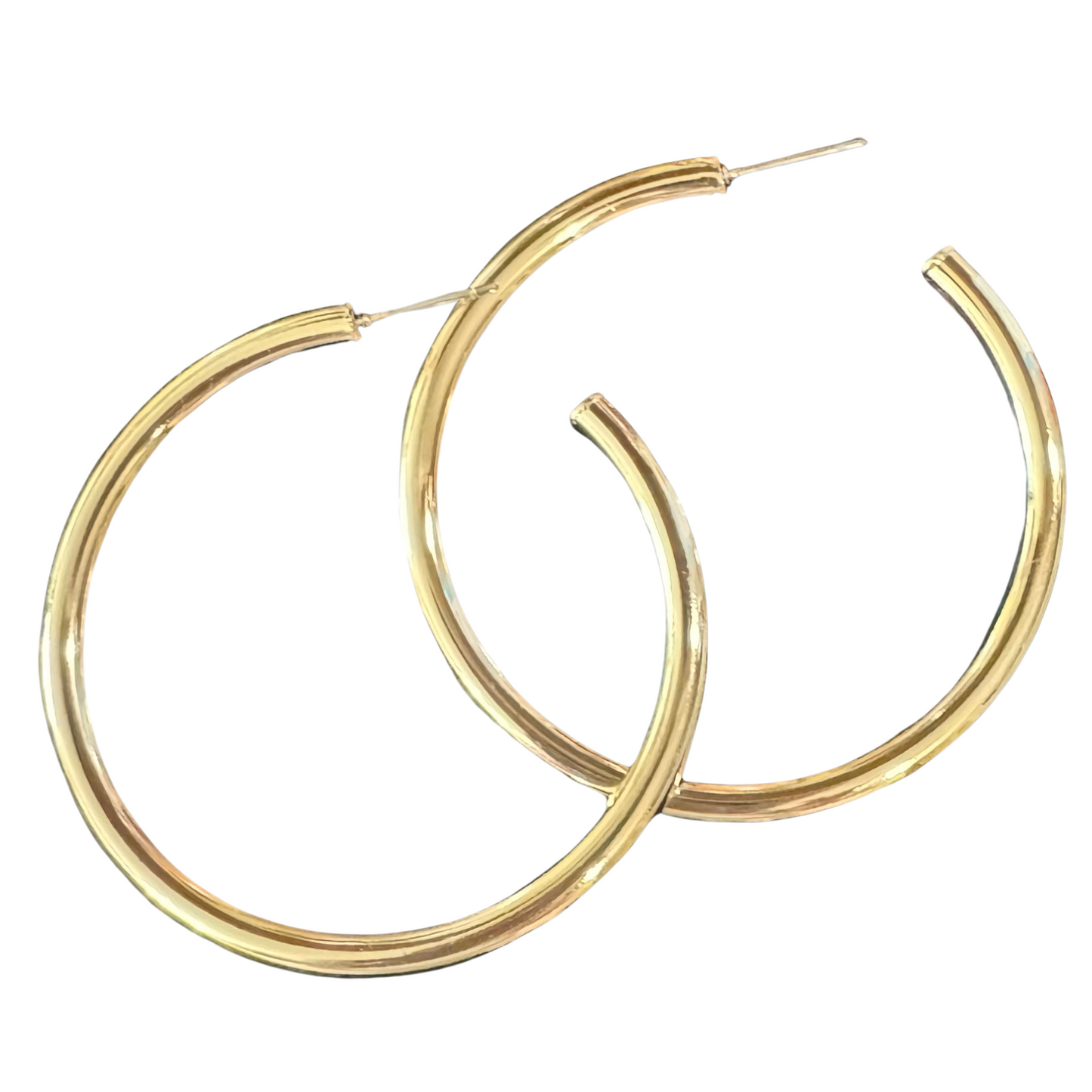 Take your style to the next level with our Large Hoop Earrings. These elegant hoops are dipped in gold for a luxurious touch, adding a classic and timeless element to any outfit. From our trusted Tell Your Tale brand, these hoops are perfect for making a stylish statement.