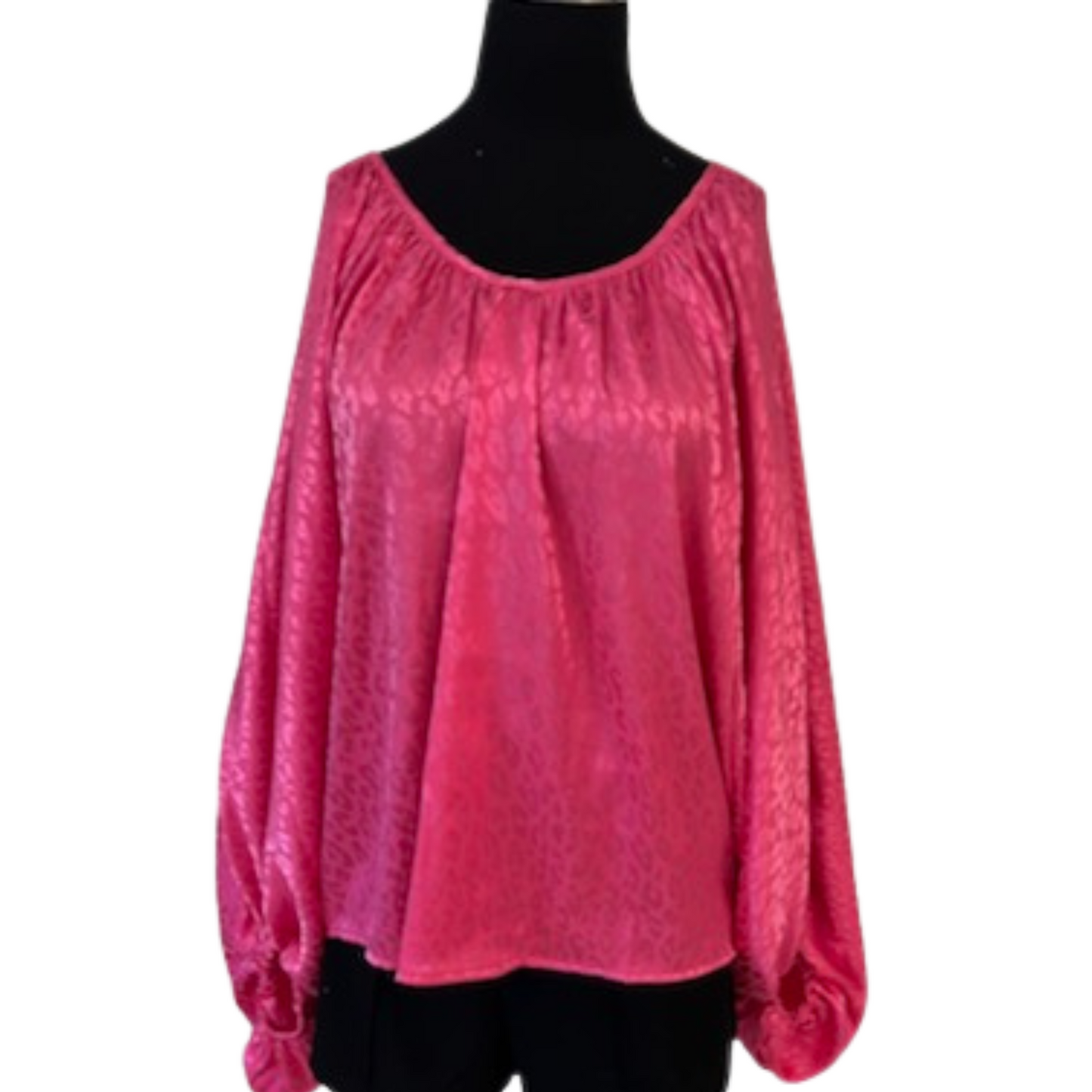 This Leopard Print Tie Back Top is the perfect way to make a statement. Available in regular and plus sizes, the hot pink, long-sleeved top features a sleek leopard print. With a professional, sophisticated look, you can wear it day or night.