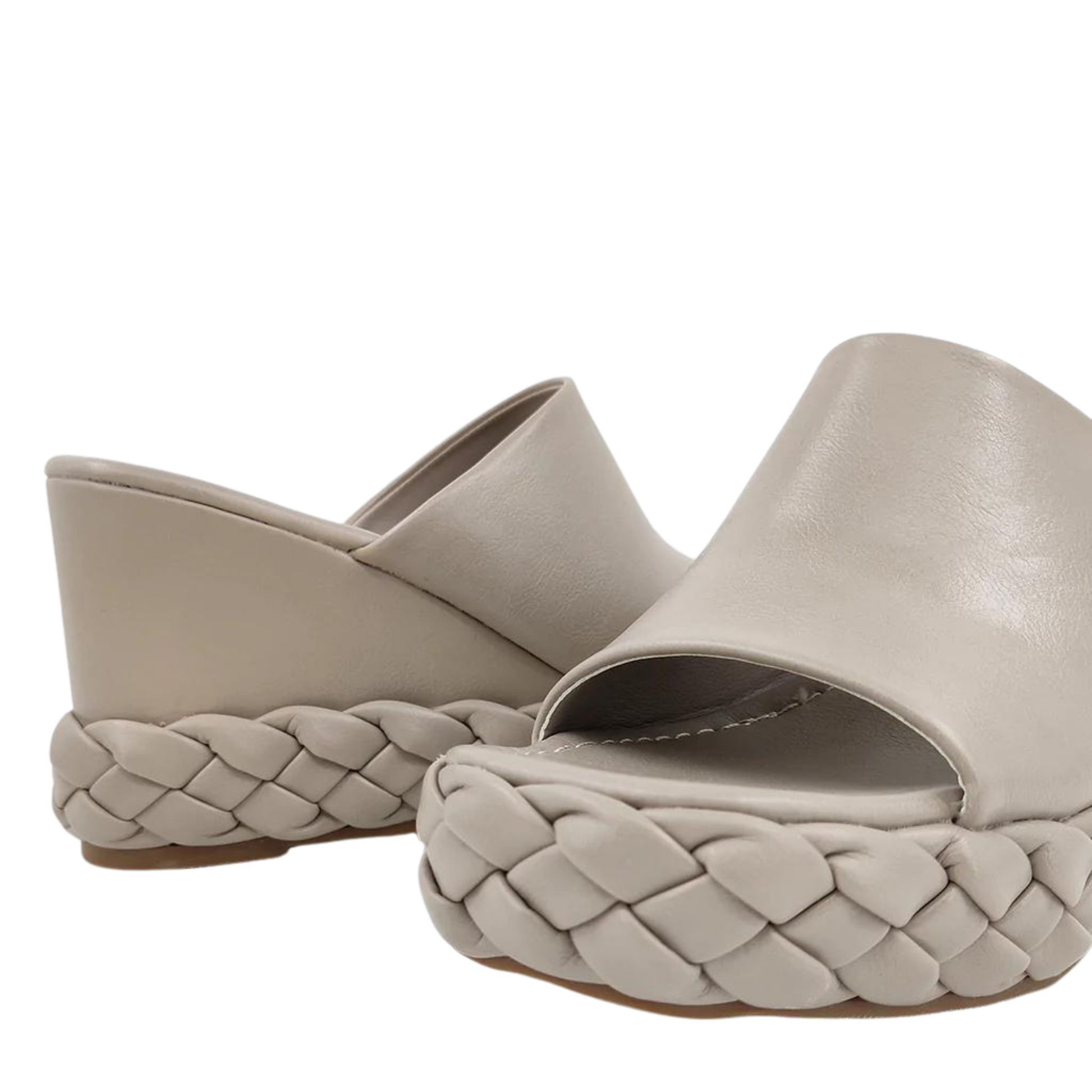 Letizia sandals provide an elegant, modern look with their braided sole and open toe wedge design. The taupe and black colors guarantee they can match any outfit. Enjoy complete comfort with these modern summer sandals.