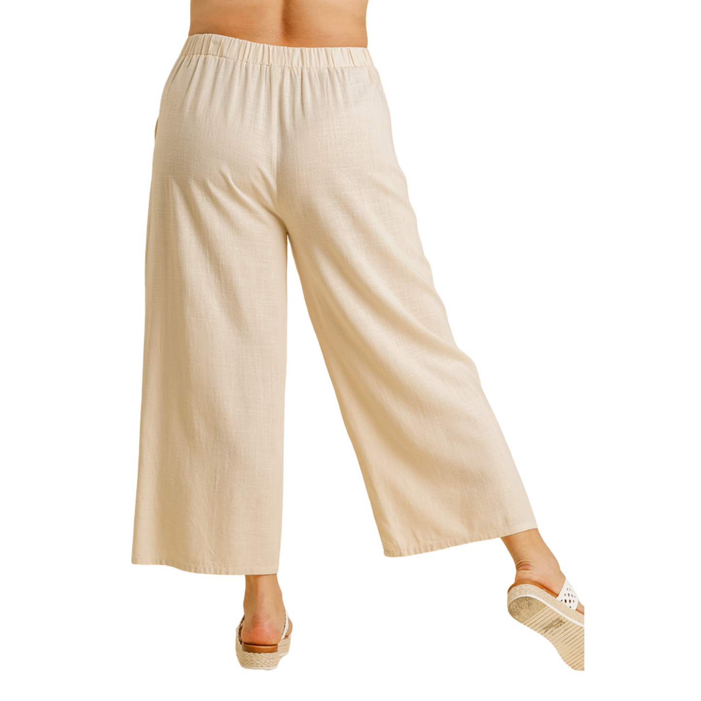 Our Linen Blend Wide Leg Pants are the perfect choice for an effortless chic look! Crafted with a breathable linen blend fabric, these pants are available in classic blue and cream colors with a drawstring for adjustable fit. Wear them for summer days or to any casual occasion for timeless sophistication.