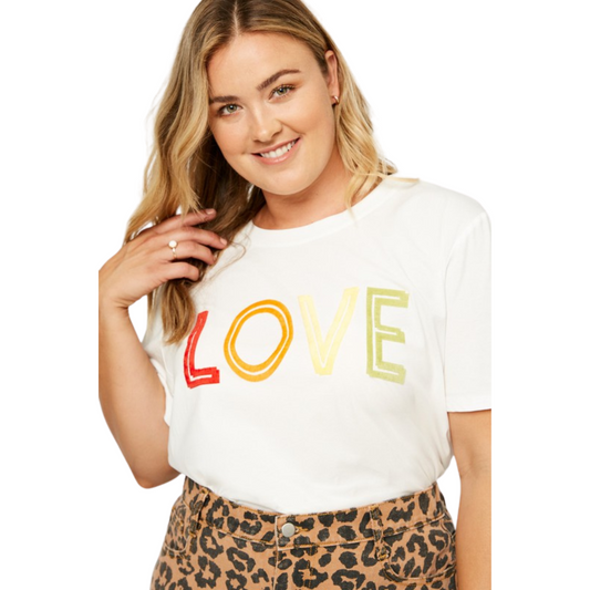 The Love Flocked Tee is a classic piece for any wardrobe. This basic tee is made from cream-colored fabric and features a modern "love" flocking detail for a subtle style upgrade. Perfect for casual or formal wear.