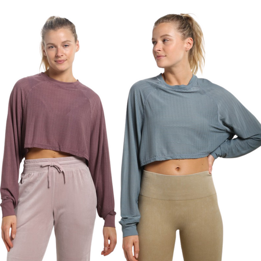 Our Mesh Raglan Cropped Top is a stylish addition to any wardrobe. This top comes in a cool sea green or mauve color with a cropped length and long sleeves. The breathable mesh fabric ensures all-day comfort.