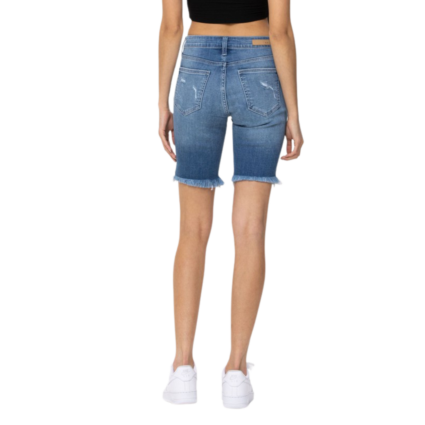 Our Mid Rise Distressed Bermuda is crafted from super-soft and comfortable fabric for an easy fit. Offered in a medium wash with raw bottom hem and distressed details, these high-style shorts make an effortlessly stylish statement.