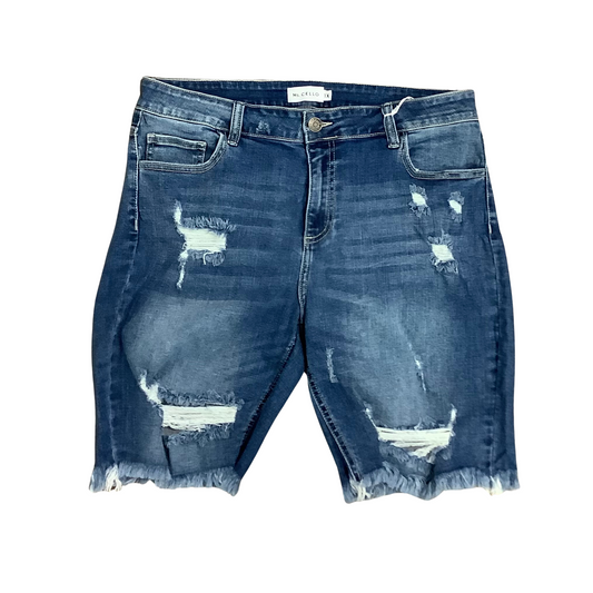 Our Mid Rise Distressed Raw Hem Bermuda is the perfect combination of style and comfort. Features include a dark wash, raw hem, and distressed details for a timeless, fashionable look. Crafted from high-quality materials for superior comfort, these bermudas will become must-have staples in your wardrobe.