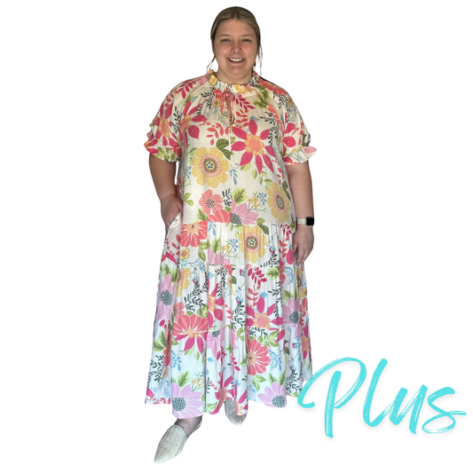 Experience effortless elegance with the Peach Blossom Maxi Dress, crafted from lightweight, flowy fabric that ensures comfort throughout the day. Its multi-tiered design adds graceful movement, while short puff sleeves and a V neckline with a delicate tie enhance its feminine appeal. The relaxed, loose fit offers ease and versatility, complemented by practical side pockets for convenience. Perfect for warm weather or special occasions, this dress combines style and functionality with expert tailoring.