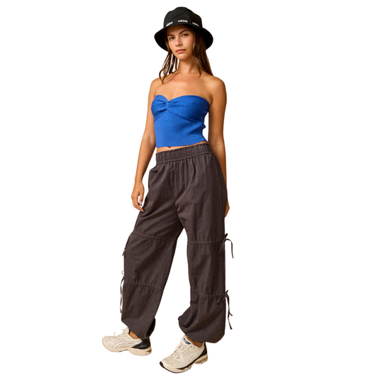 These charcoal-colored jogger pants from Papermoon feature a sleek side ribbon detail that enhances their modern silhouette. Crafted for both comfort and style, they offer a tailored fit ideal for casual or athleisure looks. The subtle ribbon accent adds a refined touch, making these joggers a versatile wardrobe essential.