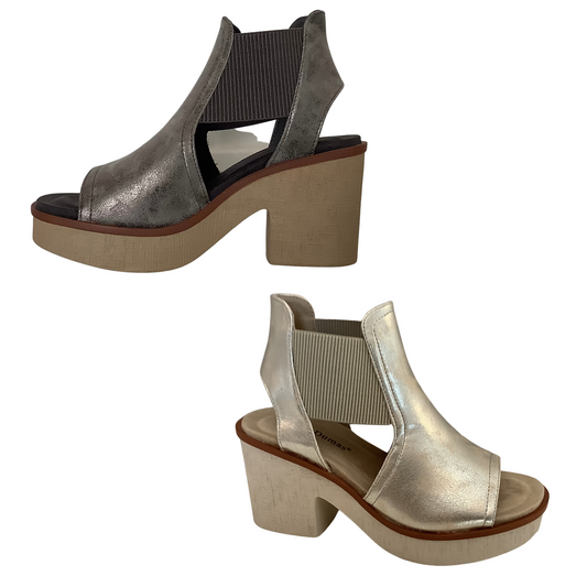 Clue-9 sandals offer a sleek and stylish look in two colors, gold and pewter. Wedges provide a stable foundation and the open toe feature adds an effortless, airy feel. Take your look up a notch with Clue-9 sandals.
