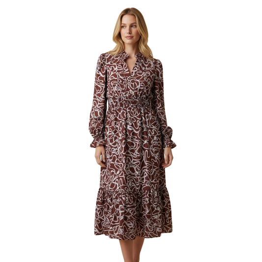 Embrace effortless elegance with this stunning Abstract Print Tiered Dress from Hemish USA. Crafted for the modern woman, this plus-size midi features long sleeves and an eye-catching abstract print that adds visual interest to any wardrobe. The smocked bodice provides comfortable support and flattering fit, while tiered layers create beautiful movement and dimension. Perfect for casual outings, work events, or weekend adventures. A versatile piece that celebrates individuality and style.
