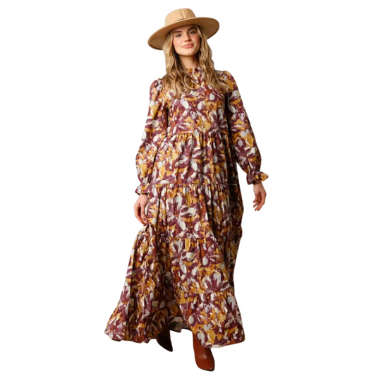 This Abstract Print Maxi Dress offers a classic and sophisticated silhouette with modern details. Featuring a ruffled mock neck, back button keyhole closure, and long balloon sleeves, this dress is designed to flatter any figure. The breathable and lightweight fabric allows you to stay comfortable throughout the day.