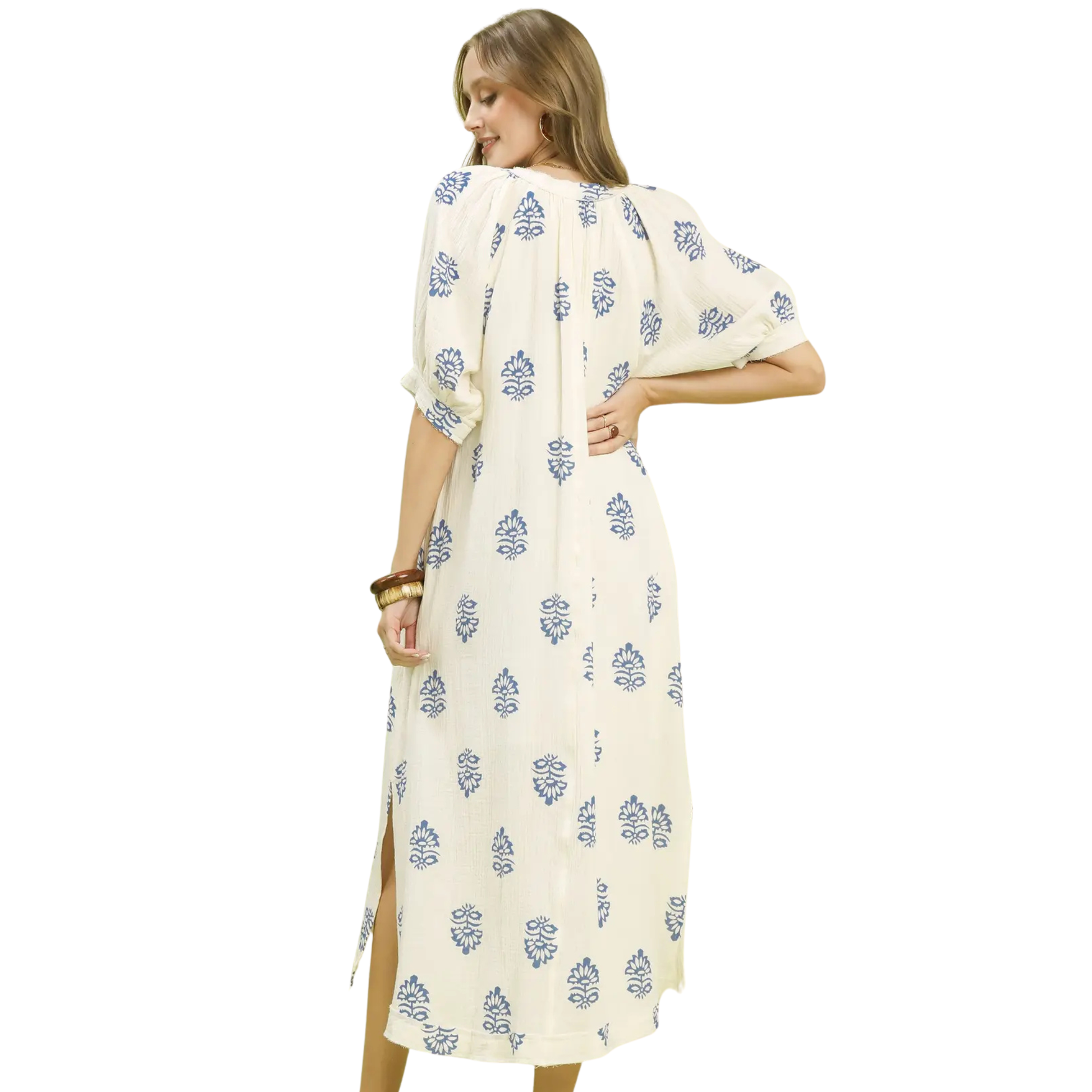 This Umgee midi dress combines understated elegance with artistic design. The off-white canvas showcases a striking abstract print that adds visual interest without overwhelming your look. Cut with a graceful V-neckline and midi length, it strikes the perfect balance between sophistication and wearability. The thoughtful silhouette flatters various body types while maintaining a polished aesthetic. 