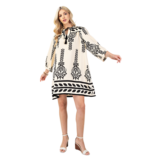 Elevate your wardrobe with this stunning ivory mini dress from GiGio. Featuring an abstract design that catches the eye, this piece combines sophistication with modern flair. The tassel tie detail adds a playful touch, while the 3/4 length sleeves provide comfortable coverage. Designed with plus-size fit in mind, this dress offers flattering proportions and confident style. Perfect for casual outings, date nights, or any occasion where you want to feel fabulous and fashion-forward.