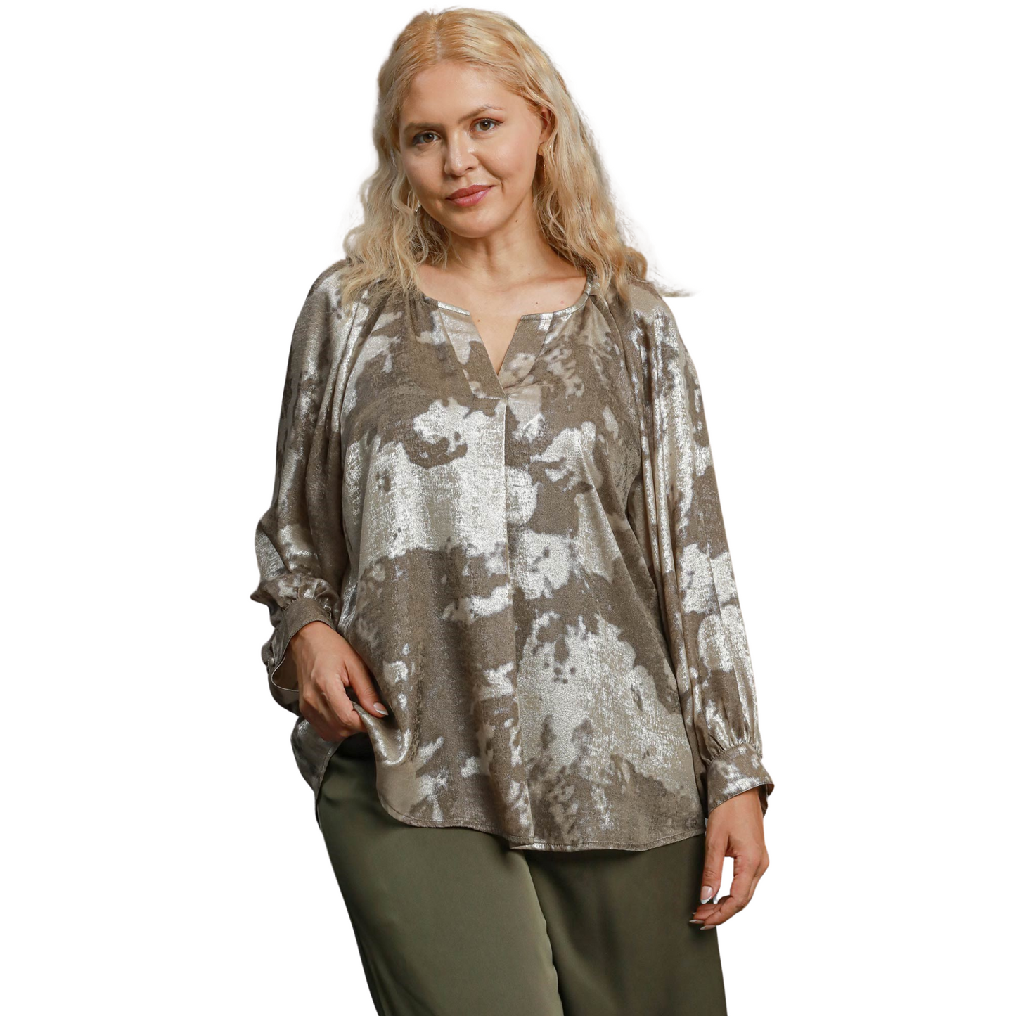 The Umgee Metallic V-Notched Top features a stylish v-neck and abstract design in a chic taupe color. Its unique design blends fashion and comfort, making it a must-have addition to any wardrobe. Elevate your look with this effortlessly trendy top.