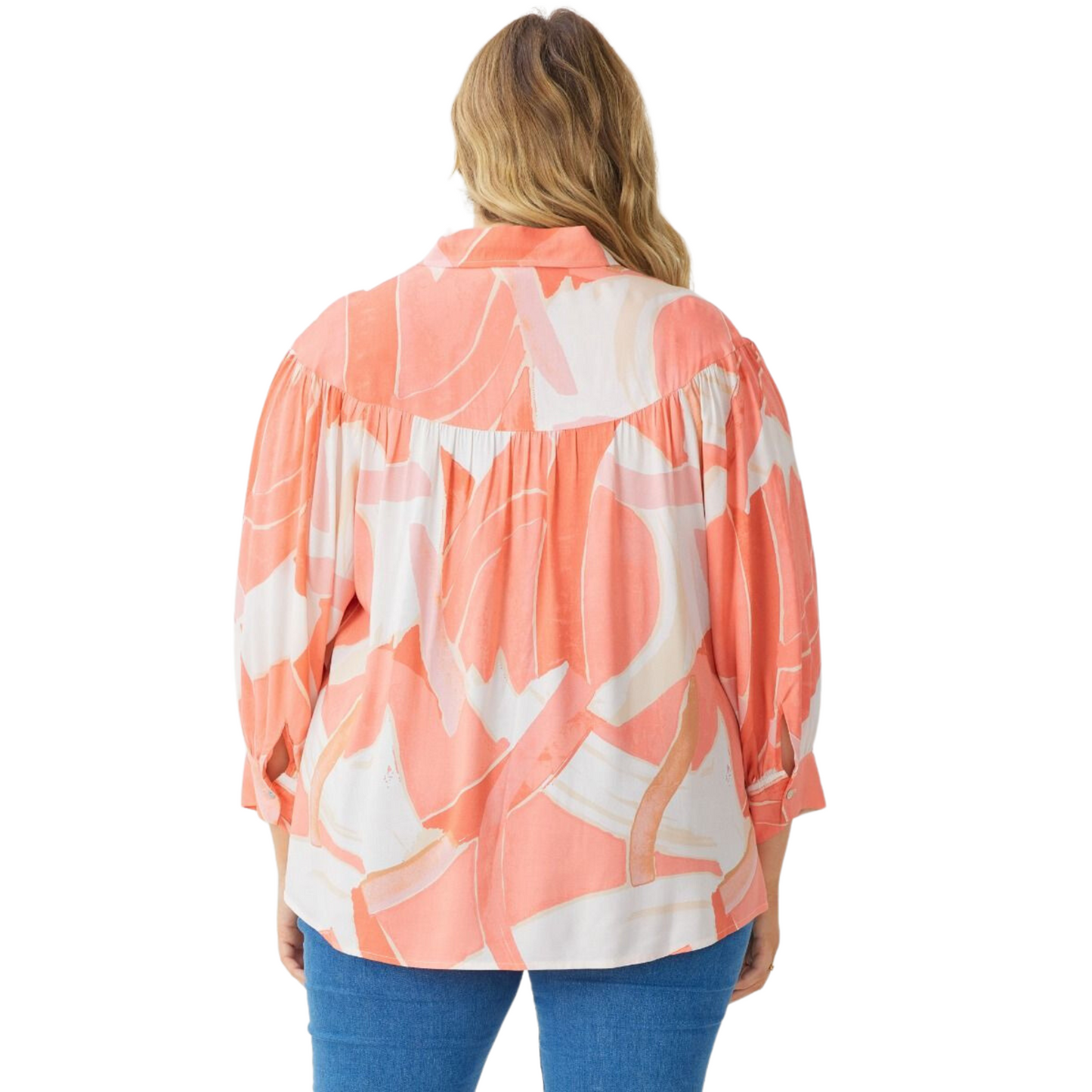 Plus size print collared button up long sleeve top featuring gathering at yoke. Button closure at sleeves. Unlined. Woven. Non-sheer. Lightweight.