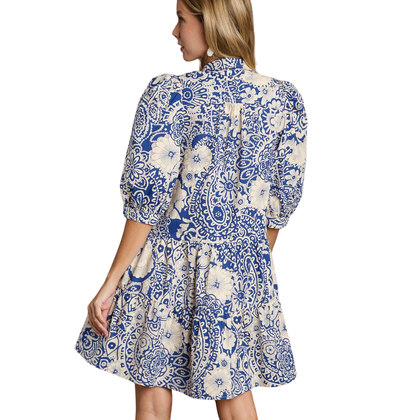 The Umgee Two Tone Print Dress offers a stylish blue mix and short sleeve design, perfect for any occasion. Made with high-quality materials and the trusted Umgee brand, this mini dress is sure to make a statement. Upgrade your wardrobe with this must-have piece.