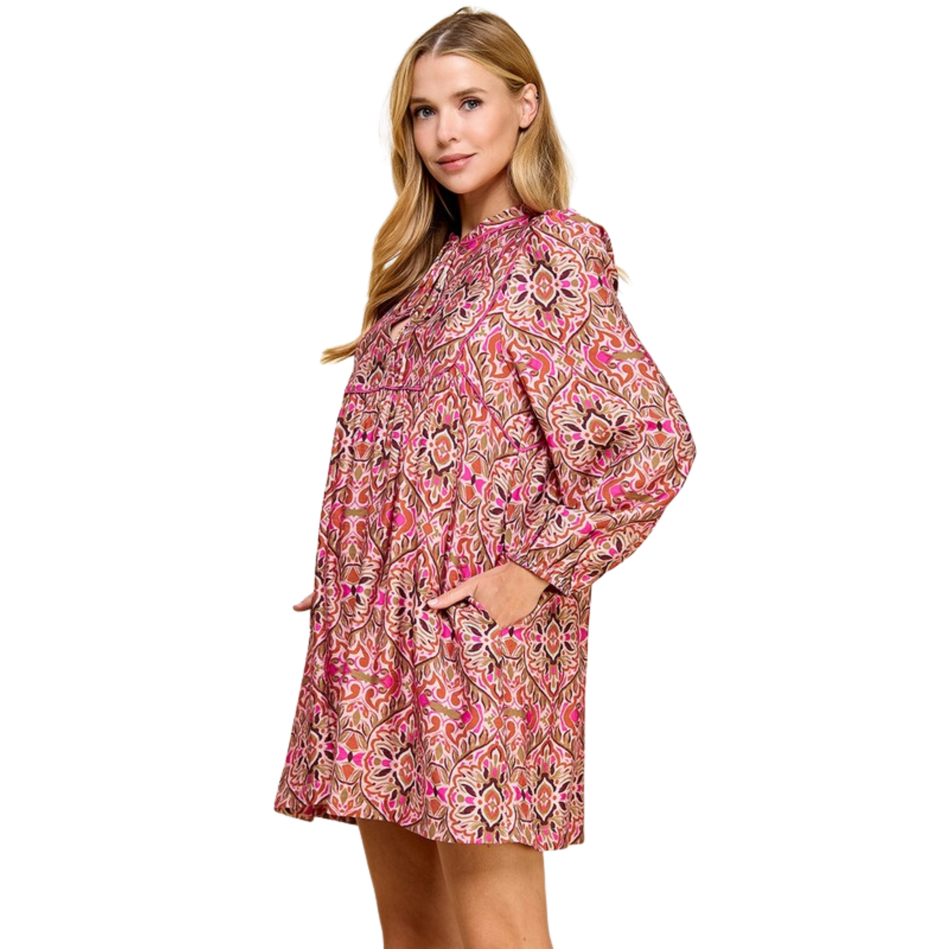 This abstract print mini dress offers a stylish and comfortable fit with its loose silhouette and long sleeves. The split neckline and adjustable neck tie add a touch of elegance to the fuchsia-colored dress. Perfect for adding a pop of color to your wardrobe while staying trendy.