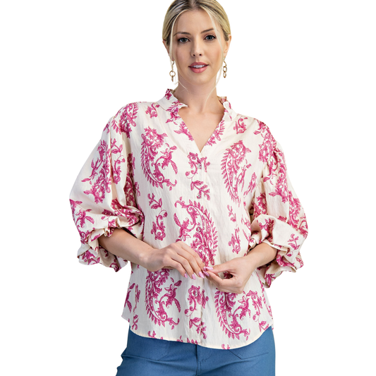 Elevate your wardrobe with this stunning Button Down Balloon Sleeve Top from GiGio. Featuring a vibrant fuchsia base adorned with an eye-catching abstract print, this piece brings artistic flair to everyday styling. The flattering 3/4 length balloon sleeves add dimension and movement, while the classic button-down front offers versatile layering options. Perfect for transitional seasons, pair it with your favorite jeans or trousers for an effortlessly chic look that stands out.