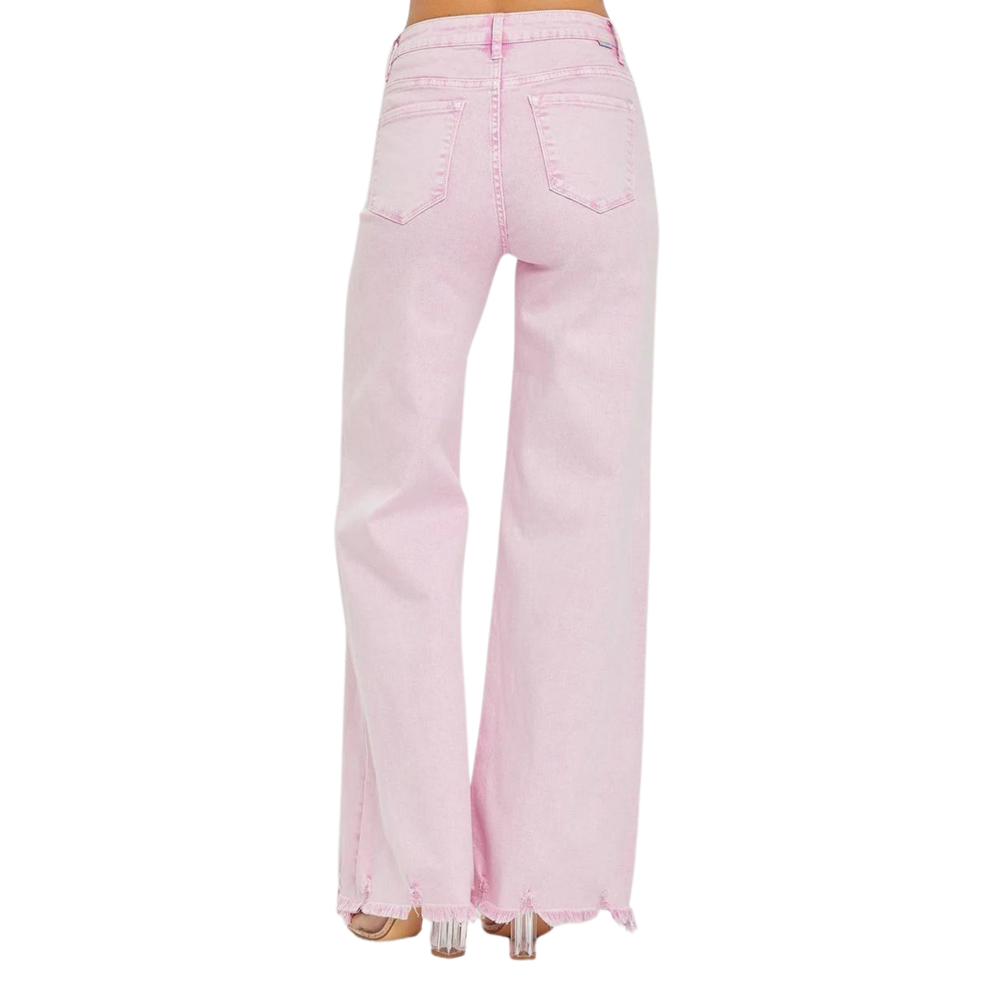 These High Rise Straight Leg Jeans from Risen are designed to flatter with their tummy control feature. The raw hem and side slit add a trendy touch to the classic straight leg style, while the acid pink color adds a unique pop of color. Elevate your denim game with these chic and comfortable jeans.