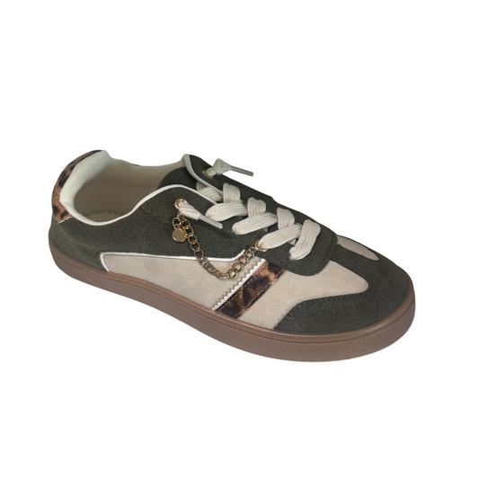 The Alyson sneaker by Jellypop combines sporty comfort with a touch of luxury, featuring a sleek design accented by a distinctive gold chain detail. Expertly crafted for both style and durability, this sneaker elevates casual wear with its unique embellishment, making it a versatile choice for those seeking refined yet comfortable footwear.