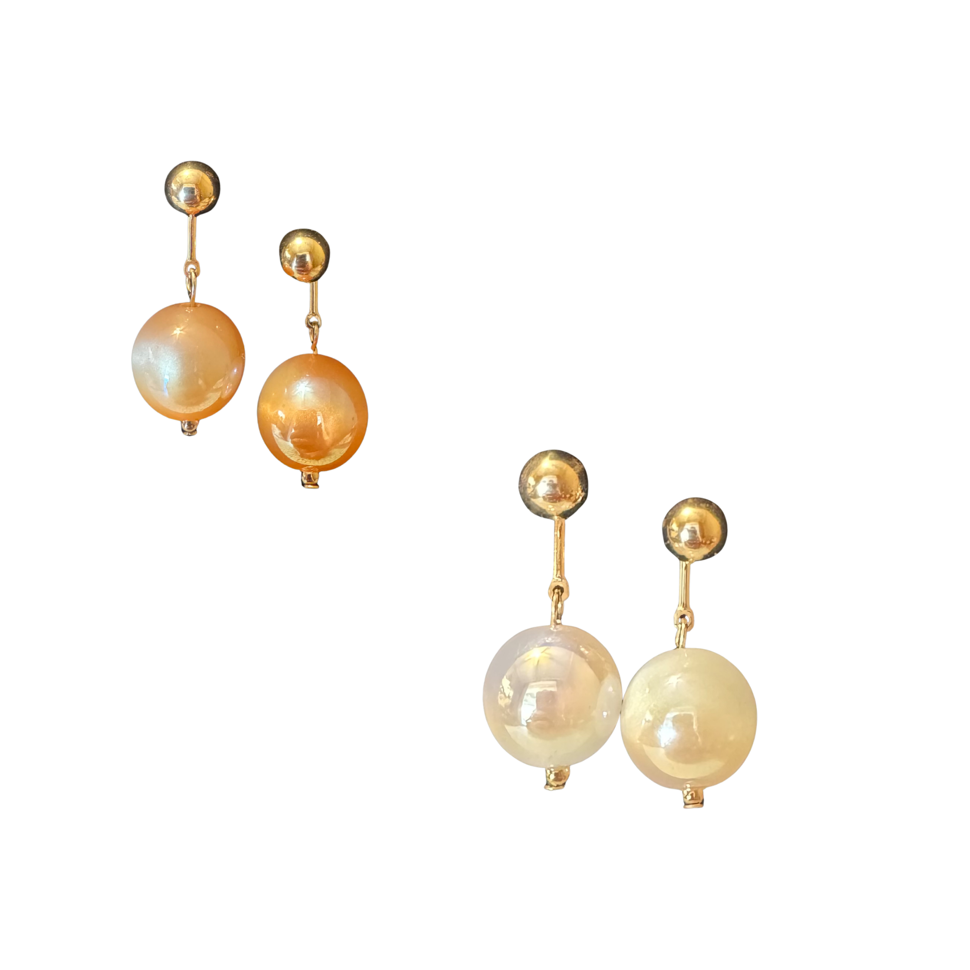 Elevate your jewelry collection with these exquisite gold dangle earrings from Perdido Gems. Featuring lustrous ball accents that catch light beautifully, these pieces offer sophisticated movement and timeless elegance. The carefully crafted design balances delicate proportions with substantial presence, making them versatile enough for everyday wear yet refined enough for special occasions. Perdido Gems' commitment to quality ensures lasting beauty and durability. A refined addition to any discerning jewel