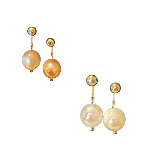 Elevate your jewelry collection with these exquisite gold dangle earrings from Perdido Gems. Featuring lustrous ball accents that catch light beautifully, these pieces offer sophisticated movement and timeless elegance. The carefully crafted design balances delicate proportions with substantial presence, making them versatile enough for everyday wear yet refined enough for special occasions. Perdido Gems' commitment to quality ensures lasting beauty and durability. A refined addition to any discerning jewel