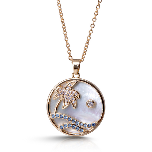 This elegant Beach Love Necklace features a stunning gold design, adorned with mother of pearl and sparkling rhinestone accents. Perfect for any beach lover, this necklace adds a touch of sophistication to any outfit. Feel confident and effortlessly stylish with this timeless piece.