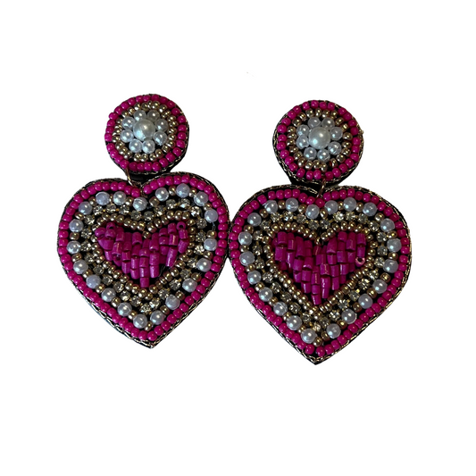 These Beaded Heart Earrings will add a pop of color to any ensemble. The drop style earrings feature heart shapes and a combination of rhinestones, pink beads, and white beads. Perfect for any special occasion!
