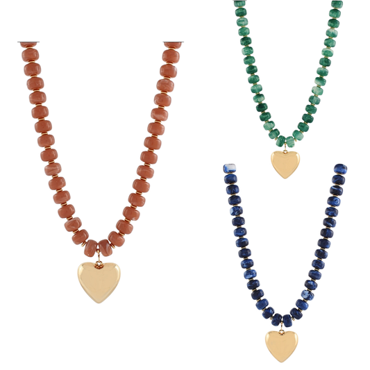 Delicate beaded short necklace featuring a charming gold heart pendant. Crafted by Golden Stella, this versatile piece combines elegance with everyday wearability. Choose from three stunning colors—blue, green, or mauve—to match your personal style. Perfect for layering or wearing solo, this necklace adds a touch of warmth to any outfit.