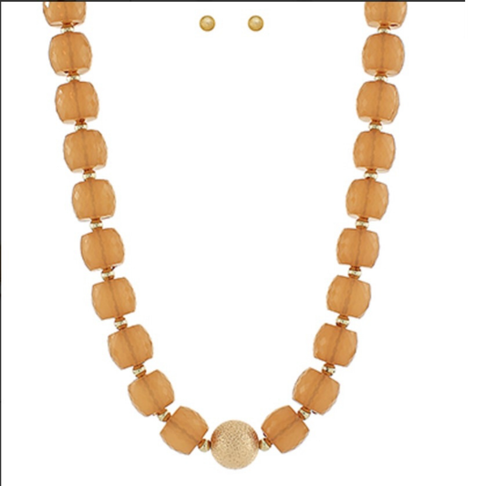 Elevate your everyday look with this stunning beaded necklace and earring set from Golden Stella. The necklace features carefully selected beads accented with warm gold tones, creating a sophisticated and versatile piece. Paired with matching gold stud earrings, this set offers effortless elegance for any occasion. Whether you're dressing up for a special event or adding polish to your daily style, this jewelry set delivers timeless appeal and quality craftsmanship.