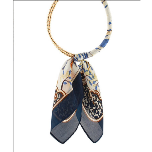 Elevate your everyday style with the Golden Stella Beaded Scarf Necklace. This unique piece combines luxurious gold beads with a soft, wrapped scarf design for a versatile accessory that transitions seamlessly from casual to sophisticated. The scarf element adds texture and movement, while the gleaming gold beads catch the light beautifully. Perfect for layering or wearing solo, this necklace brings an effortless elegance to any outfit. 