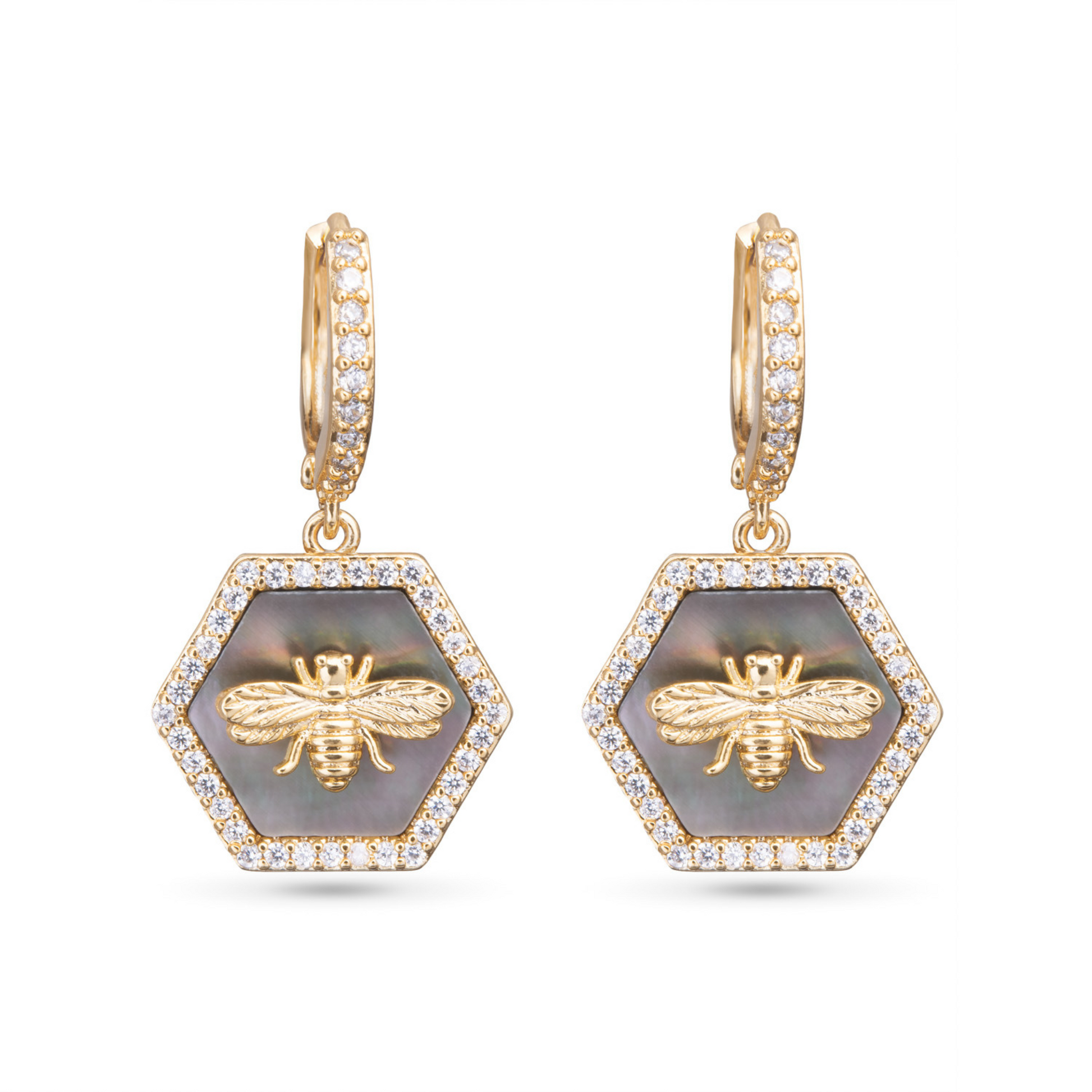 These Hexagon Bee Earrings are a stunning addition to any jewelry collection. Made with grey mother of pearl and sparkling rhinestone accents, these dangle earrings feature a beautiful bee design adorned with cubic zirconia. Elevate any outfit with these unique and elegant earrings.