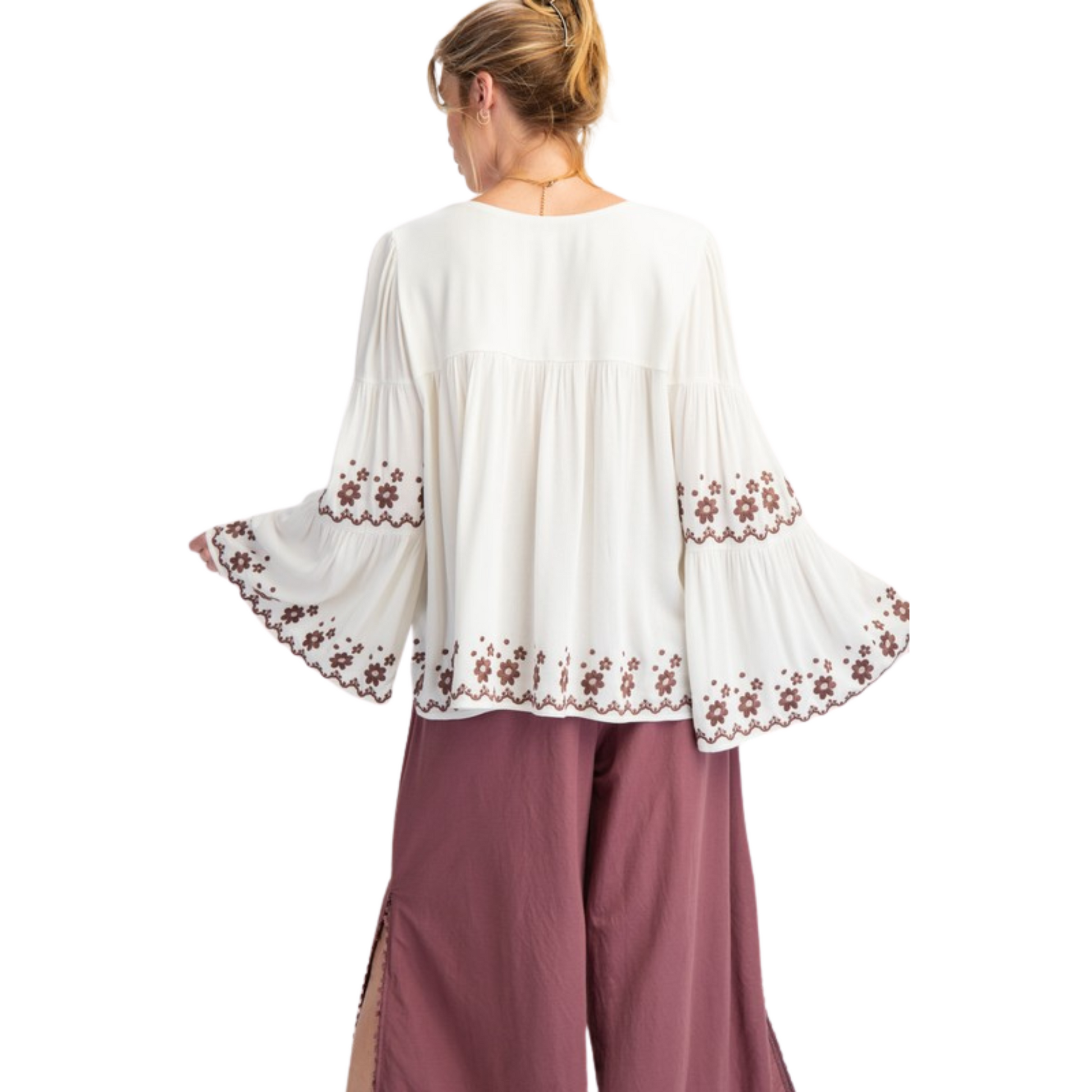 Experience effortless style in our Bell Sleeve Embroidered Tiered Top. The ivory color and flower pattern embroidery detailing add a touch of elegance, while the square neckline and relaxed fit provide comfort. The lightweight fabrication and flowy silhouette make this top perfect for any occasion. Plus size and long bell sleeves make it a versatile choice.