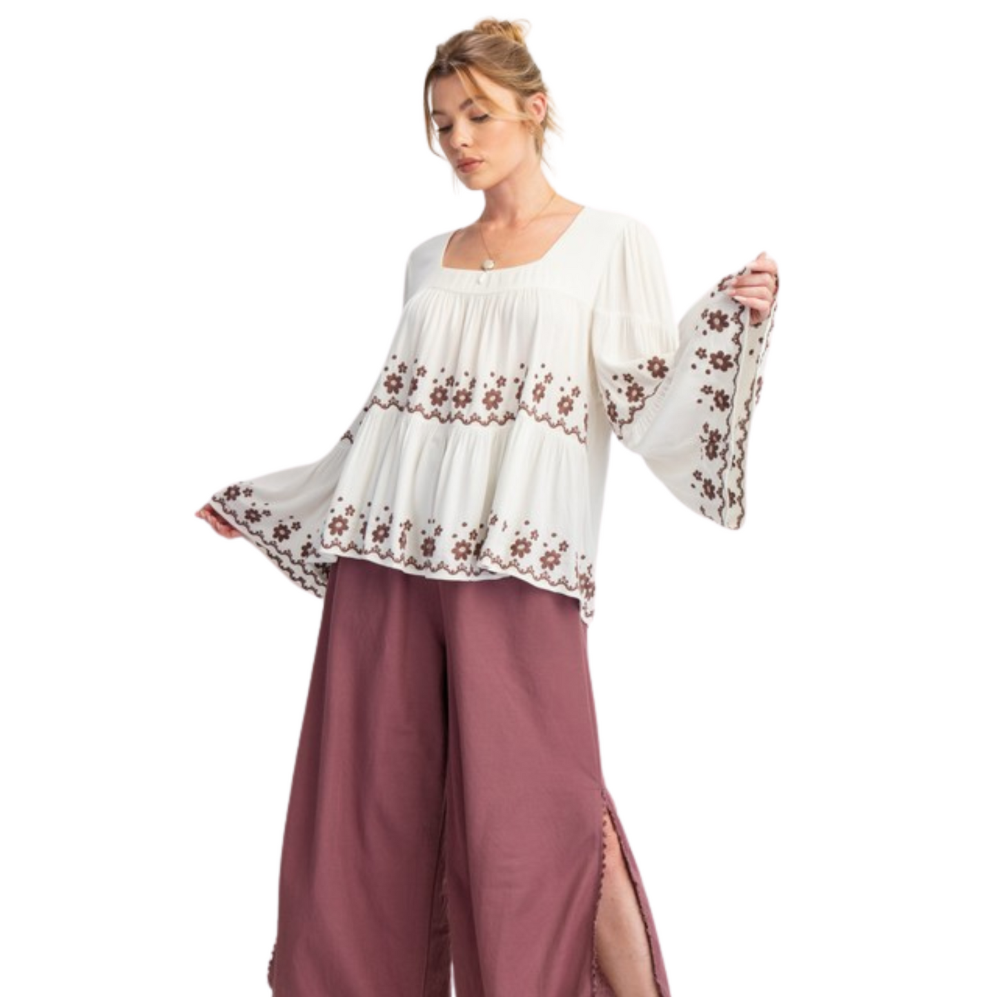 Experience effortless style in our Bell Sleeve Embroidered Tiered Top. The ivory color and flower pattern embroidery detailing add a touch of elegance, while the square neckline and relaxed fit provide comfort. The lightweight fabrication and flowy silhouette make this top perfect for any occasion. Plus size and long bell sleeves make it a versatile choice.