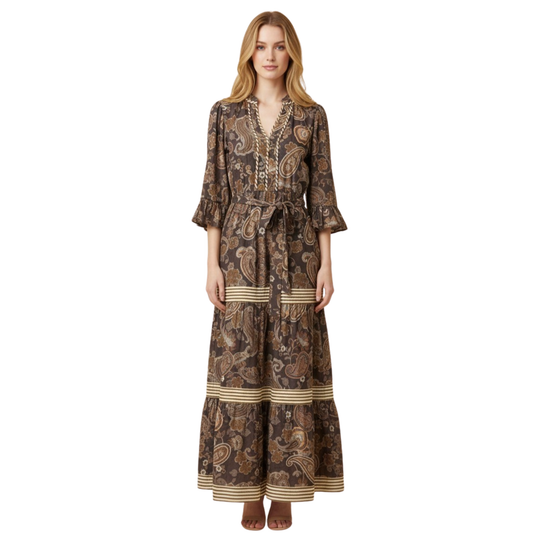 Elegant brown paisley print maxi dress from Hemish brand. Features a flattering v-neck neckline, long sleeves, and a defined belted waist that accentuates your silhouette. The tiered design adds movement and dimension for a sophisticated, body-conscious look. Perfect for elevated everyday wear or special occasions.