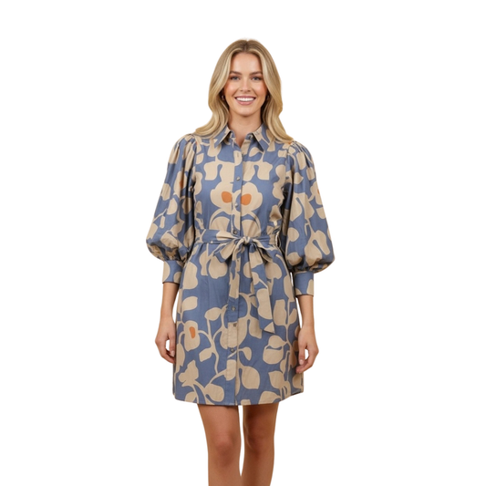 The Belted Mini Shirt Dress by Hemish combines timeless style with modern charm. This thoughtfully designed piece features a botanical print that brings nature-inspired elegance to your wardrobe, while puff sleeves add a playful, feminine touch. The button-down front allows for effortless styling — wear it as a complete look or layer it over your favorite basics. A cinched waist with removable belt defines your silhouette and creates a flattering, polished appearance. 