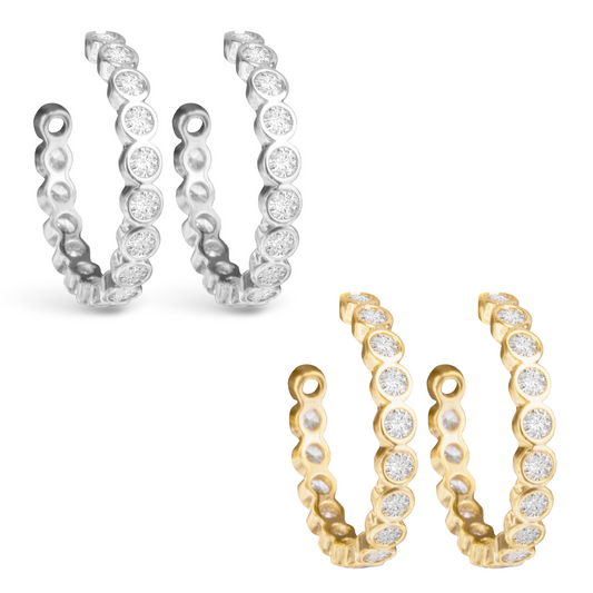 Improve your style with our Bezel Hoop Earrings, featuring a rhinestone lining that adds a touch of elegance. Choose from silver or gold to complement any outfit. Upgrade your accessory game with these beautiful and versatile hoop earrings.